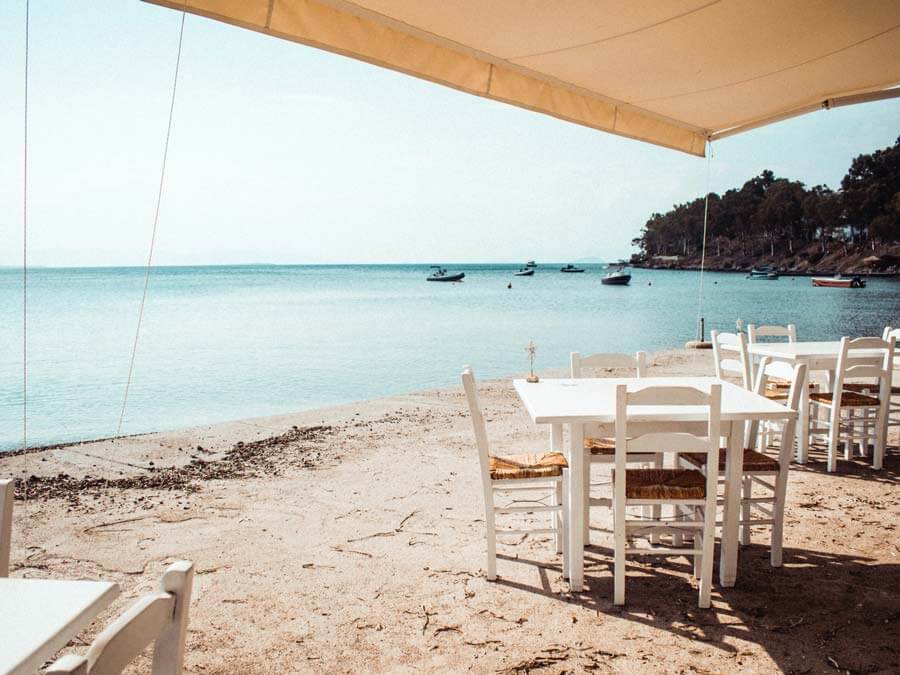 Credit: Lucas Cleutjens on Unsplash A tavern in Aegina island, day trip from Athens