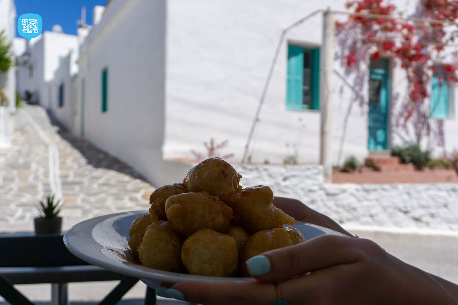Credit: Greek TravelTellers Enjoying sweet lukumades in Paros